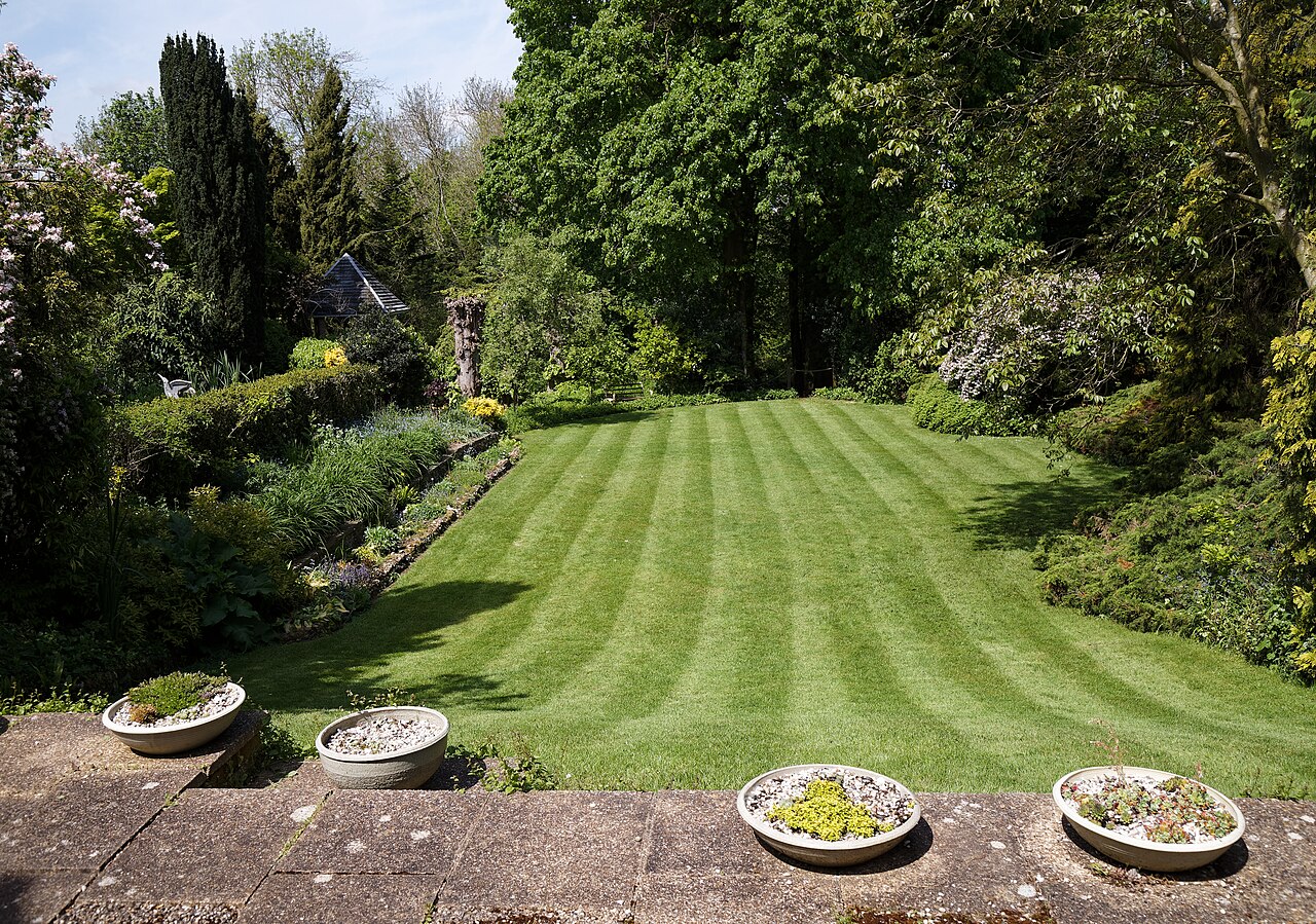 A striped lawn between planted borders
